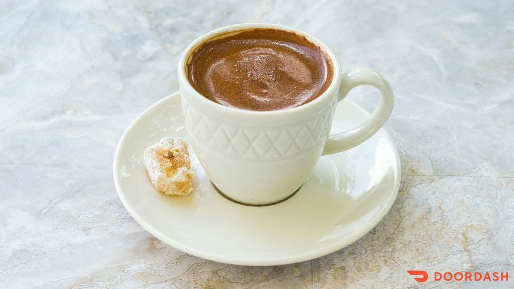 Turkish Coffee — Traditional Turkish coffee brewed in a copper cezve, served with lokum.